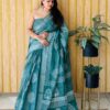 Soft Linen Cotton Silk Saree, featuring digital Batik print, woven silver border & printed pallu. Comes with a matching printed blouse. Price: ₹695/-. Premium Assured Quality!
